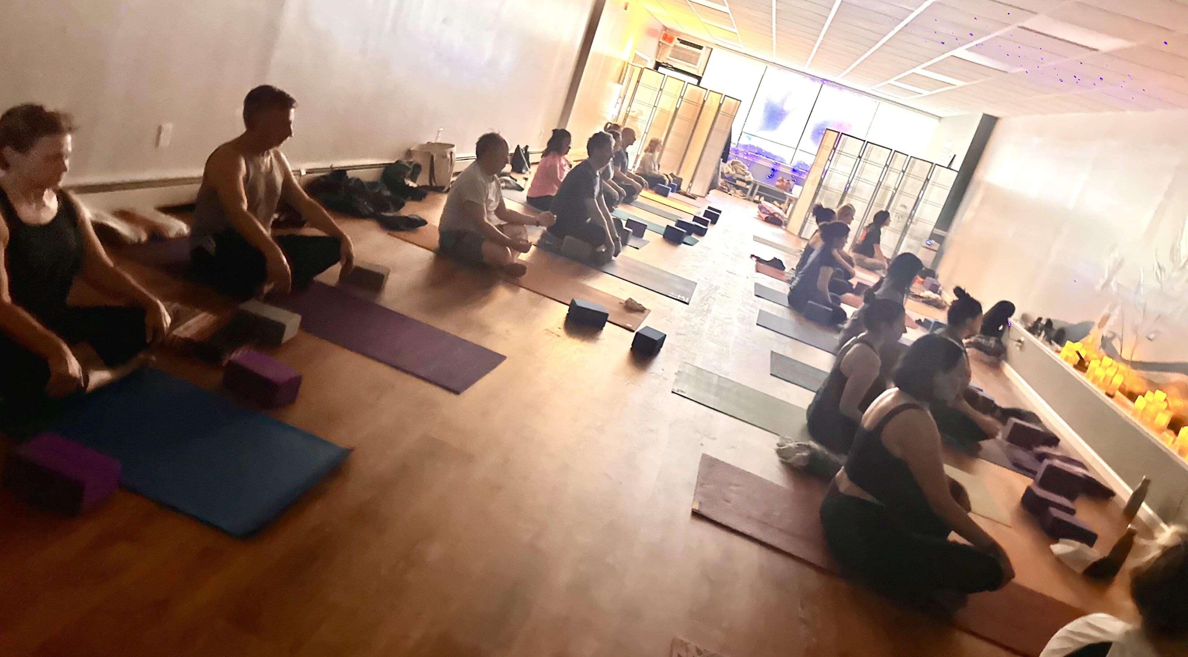 Group yoga meditation class in studio